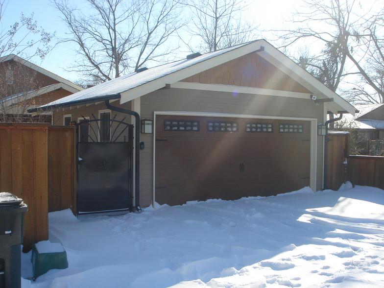 A detached garage designed to match the house can make good use of small lots.
