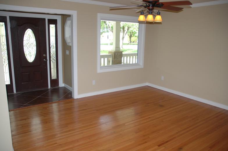 The original wood floors were refurbished and a new entry way was added to this house.