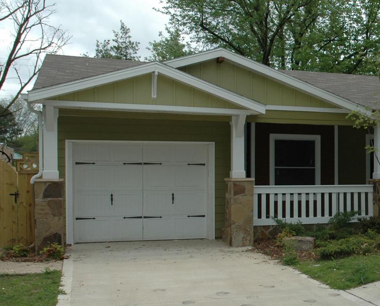 The original garage was converted to a den and this new garage was added to the front.