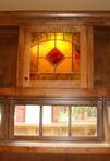 A backlit stained glass window can be used to replace a basic cabinet door.